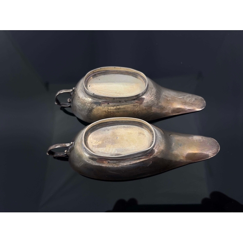 182 - A pair of George V silver sauce boats, S Blackensee and Son, Birmingham 1922, narrow slipper form wi... 