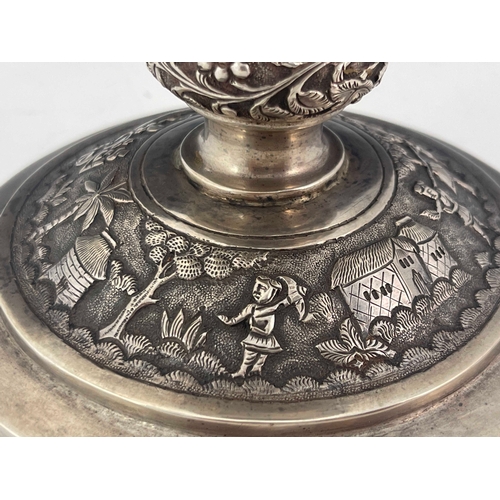 183 - A large Indian white metal trophy, circa 1900, embossed with Hindu village scene, engraved for the L... 