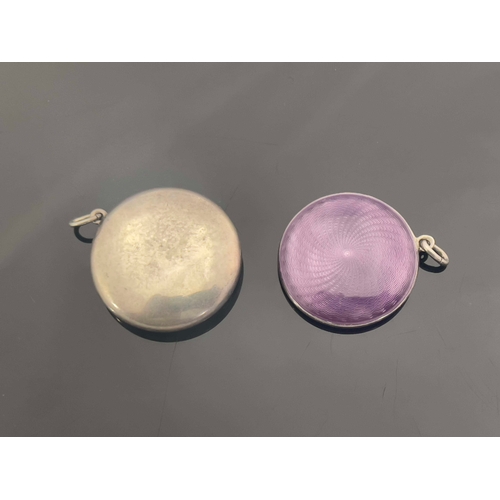 215 - Two silver and enamelled pendant compacts, circular form with inset hinged lids and convex mirrors, ... 