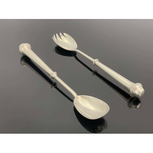 227 - A pair of Arts and Crafts silver salad servers, William Hutton and Sons, London 1901, the conical ha... 