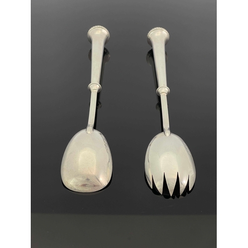 227 - A pair of Arts and Crafts silver salad servers, William Hutton and Sons, London 1901, the conical ha... 