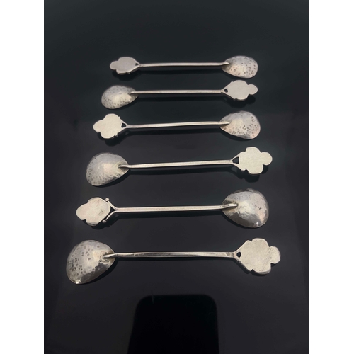 233 - Norah Creswick, a set of six Arts and Crafts Scottish white metal and harlequin hardstone set teaspo... 