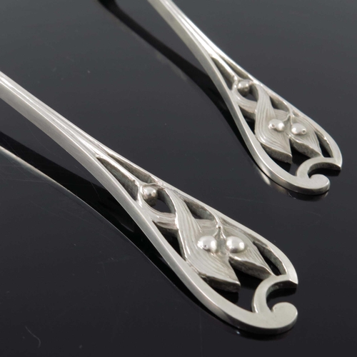 237 - Kate Harris for William Hutton, a pair of Arts and Crafts silver serving spoons, London 1901, the ca... 