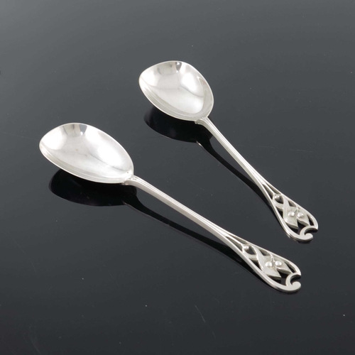 237 - Kate Harris for William Hutton, a pair of Arts and Crafts silver serving spoons, London 1901, the ca... 