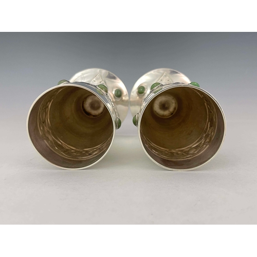 239 - Archibald Knox for Liberty and Co., a pair of Arts and Crafts Cymric silver and cabochon set vases, ... 