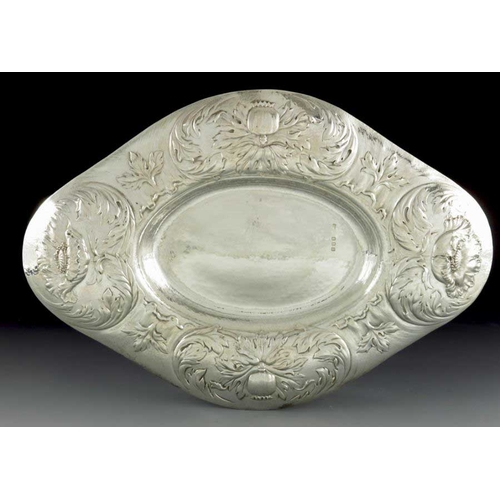 245 - Gilbert Marks, an Arts and Crafts Britannia silver dish, London 1899, quatrelobed oval form, repouss... 