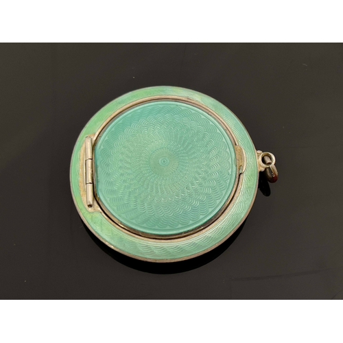 255 - An Art Deco silver and enamelled pendant compact, Turner and Simpson, Birmingham 1927, circular lens... 