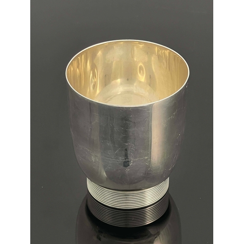 260 - Jean Emile Puiforcat, an Art Deco French silver beaker, circa 1930, rounded form on cylindrical foot... 