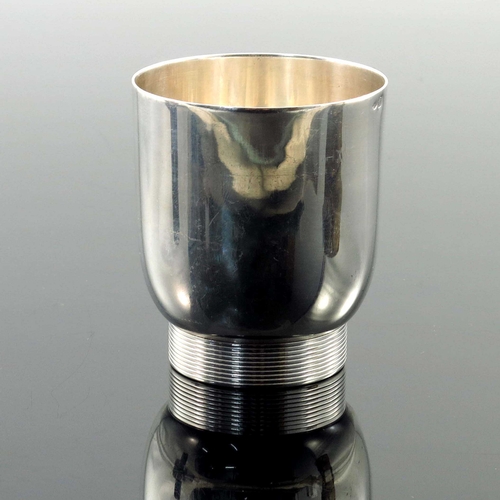 260 - Jean Emile Puiforcat, an Art Deco French silver beaker, circa 1930, rounded form on cylindrical foot... 