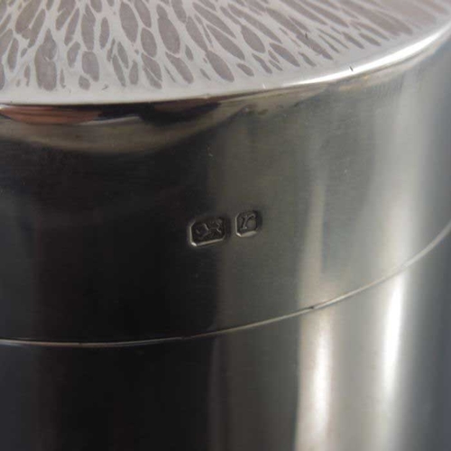 266 - A Modernist silver tea caddy, Neil Lovesey, London 1972, cylindrical form with textured bark effect ... 