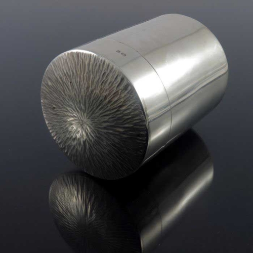 266 - A Modernist silver tea caddy, Neil Lovesey, London 1972, cylindrical form with textured bark effect ... 