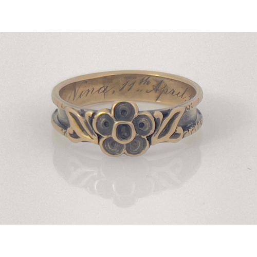 282 - A Victorian gold mourning ring, 1854, the channelled band with central forget me not rosette and lea... 