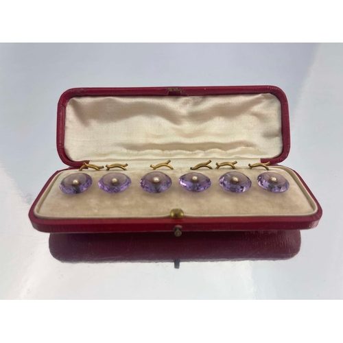 297 - A set of six amethyst, gold and split pearl buttons, each concave facet cut button with central pear... 