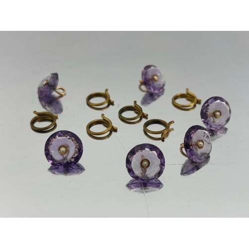 297 - A set of six amethyst, gold and split pearl buttons, each concave facet cut button with central pear... 