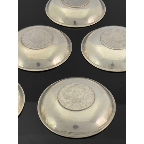 17 - A set of six white metal coin dishes, each set with a 1780 Maria Theresa thaler, 9cm diameter, 15.32... 