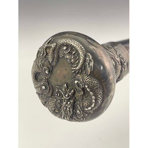 2 - A Chinese export silver knopped cane, circa 1900, pommel head embossed in high relief with dragons, ... 