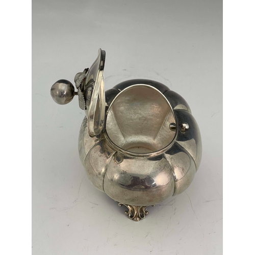 20 - A Dutch silver tea caddy,  Pieter Pieters, Amsterdam circa 1860, lobed ovoid form on cast foliate br... 