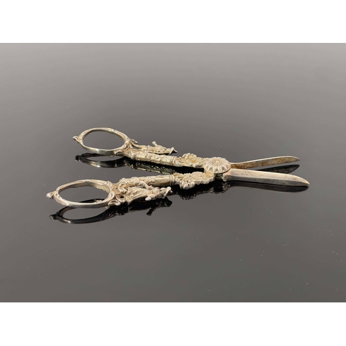 23 - A pair of cast white metal grape scissors, probably Dutch, circa 1890, in the Rococo style, modelled... 