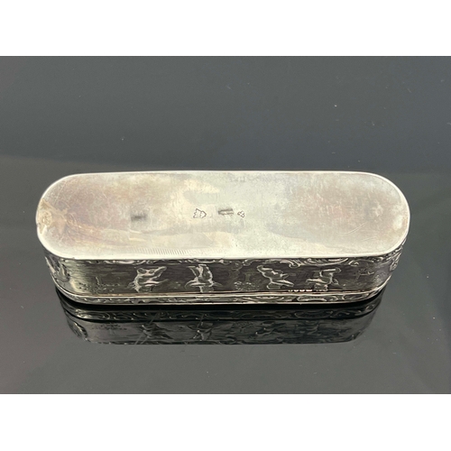 24 - A Dutch silver snuff box, rounded oblong form, the hinged lid and base embossed with putti within C ... 