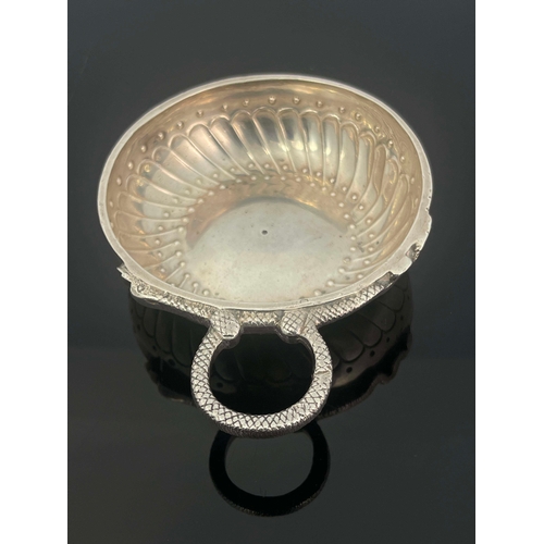 28 - A Late 18th century French silver wine taster, shallow dished circular form with embossed gadrooned ... 