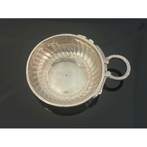 28 - A Late 18th century French silver wine taster, shallow dished circular form with embossed gadrooned ... 