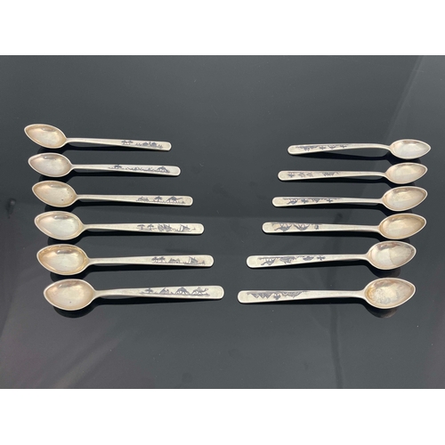 32 - A set of 12 niello white metal spoons, unmarked, Egyptian scenes niello to handle, 11cm length, 4.69... 