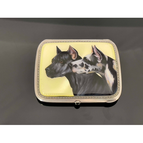 41 - A silver and enamelled cigarette case, the lid painted with two dogs, on yellow guilloche enamel gro... 