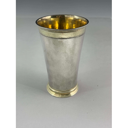 43 - An early 18th century German silver and parcel gilt beaker, WS, Augsburg 1737-39, trumpet form, gilt... 