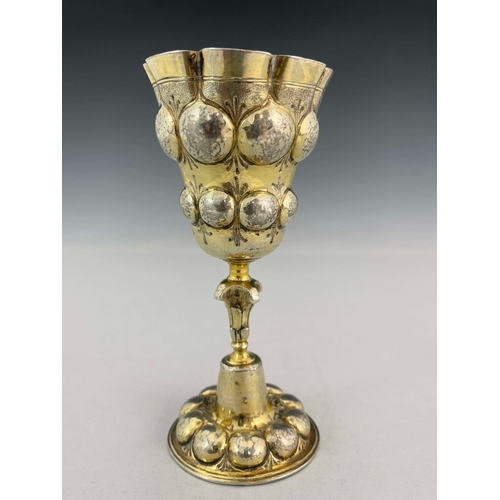 44 - A 17th century German silver gilt chalice cup, HDS, Augsburg circa 1620, the ogee bowl embossed in r... 