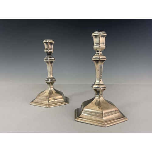 58 - A pair of George I silver candlesticks, Matthew Cooper, London 1718, hexagonal form, on stepped base... 