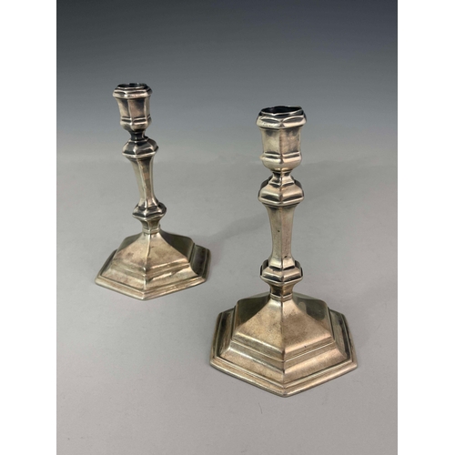 58 - A pair of George I silver candlesticks, Matthew Cooper, London 1718, hexagonal form, on stepped base... 