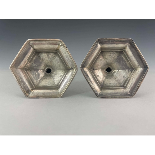 58 - A pair of George I silver candlesticks, Matthew Cooper, London 1718, hexagonal form, on stepped base... 