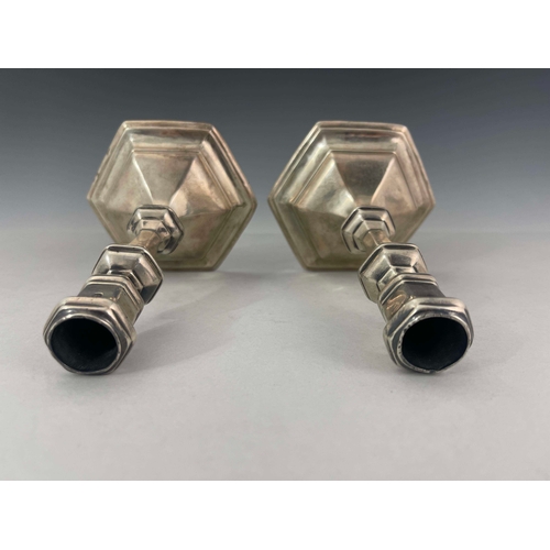 58 - A pair of George I silver candlesticks, Matthew Cooper, London 1718, hexagonal form, on stepped base... 