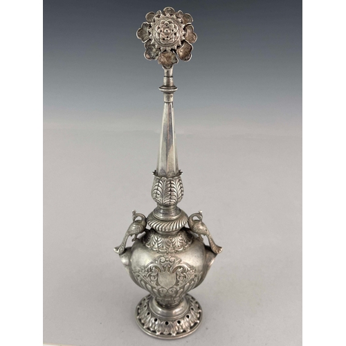 6 - A white metal water sprinkler, twin handled baluster form with elongated faceted spout and pierced f... 