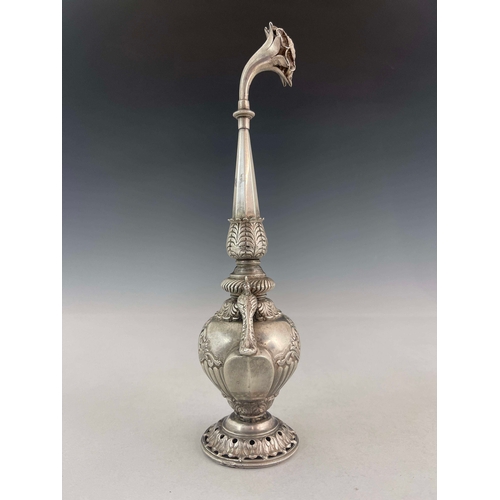 6 - A white metal water sprinkler, twin handled baluster form with elongated faceted spout and pierced f... 