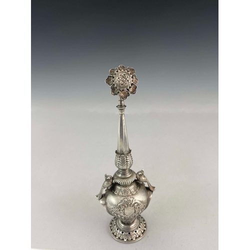 6 - A white metal water sprinkler, twin handled baluster form with elongated faceted spout and pierced f... 