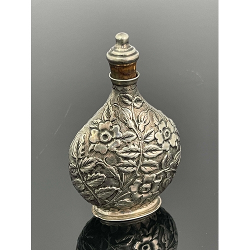 70 - A Victorian silver scent bottle, Solomon Lyon, Birmingham 1888, moonflask form, embossed and chased ... 