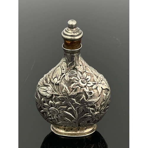 70 - A Victorian silver scent bottle, Solomon Lyon, Birmingham 1888, moonflask form, embossed and chased ... 