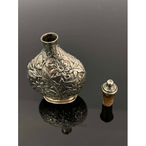 70 - A Victorian silver scent bottle, Solomon Lyon, Birmingham 1888, moonflask form, embossed and chased ... 