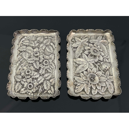 86 - Two silver rectangular dishes, makers mark M & L, Birmingham 1890, both with embossed and chased flo... 