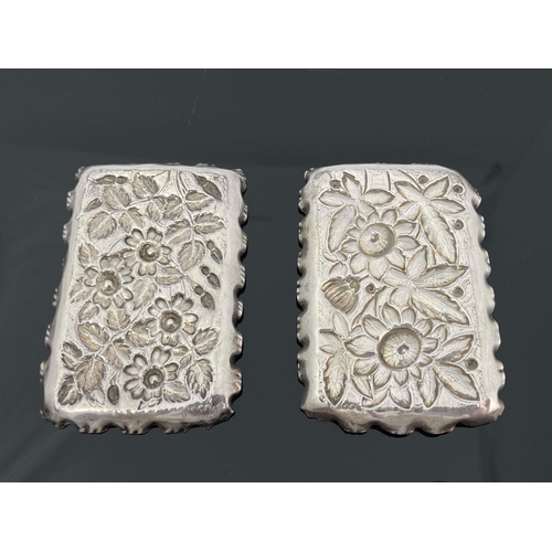 86 - Two silver rectangular dishes, makers mark M & L, Birmingham 1890, both with embossed and chased flo... 