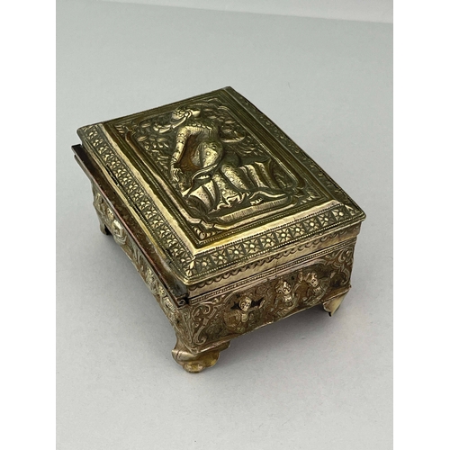 9 - An Indian white metal casket, late 19th century, repousse decorated and embossed with Oriental figur... 