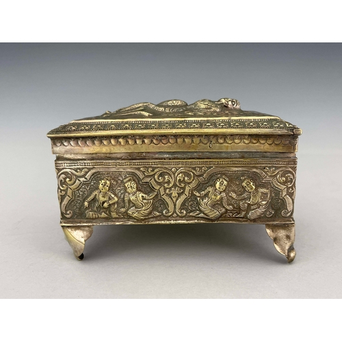 9 - An Indian white metal casket, late 19th century, repousse decorated and embossed with Oriental figur... 