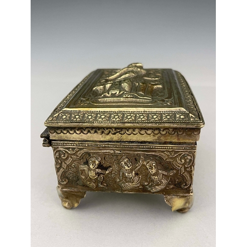 9 - An Indian white metal casket, late 19th century, repousse decorated and embossed with Oriental figur... 