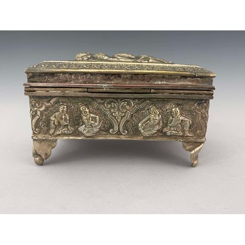 9 - An Indian white metal casket, late 19th century, repousse decorated and embossed with Oriental figur... 