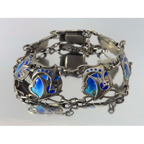 301 - Murrle Bennett and Co., an Arts and Crafts silver and enamelled bracelet, the seven panel links cast... 