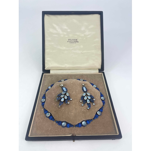 303 - Sibyl Dunlop, an Arts and Crafts silver, enamelled and moonstone necklace and earring set, the retic... 