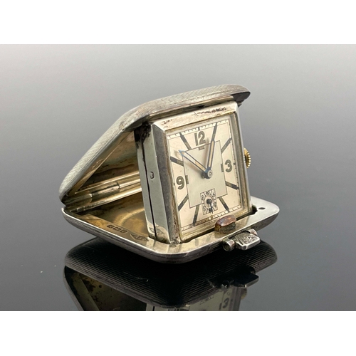 317 - An Art Deco silver cased Sapho travel watch, SSM, Birmingham 1936, square form, cushioned and spring... 