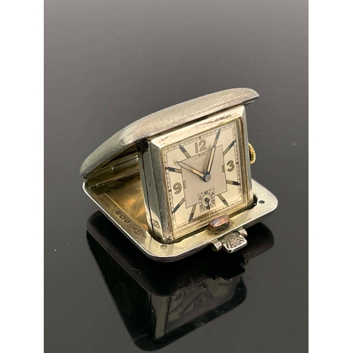 317 - An Art Deco silver cased Sapho travel watch, SSM, Birmingham 1936, square form, cushioned and spring... 