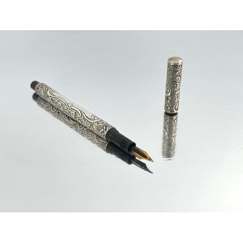 320 - James W Queen and Co., Philadelphia, a silver Number 4 fountain pen, 1905, embossed and chased folia... 